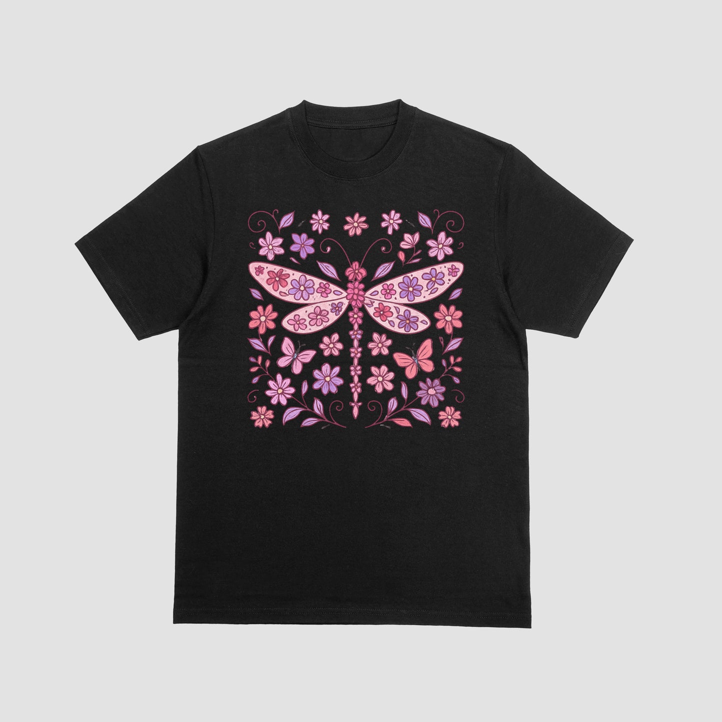Black t-shirt with a decorative design with pink dragonfly and flowers on a white background