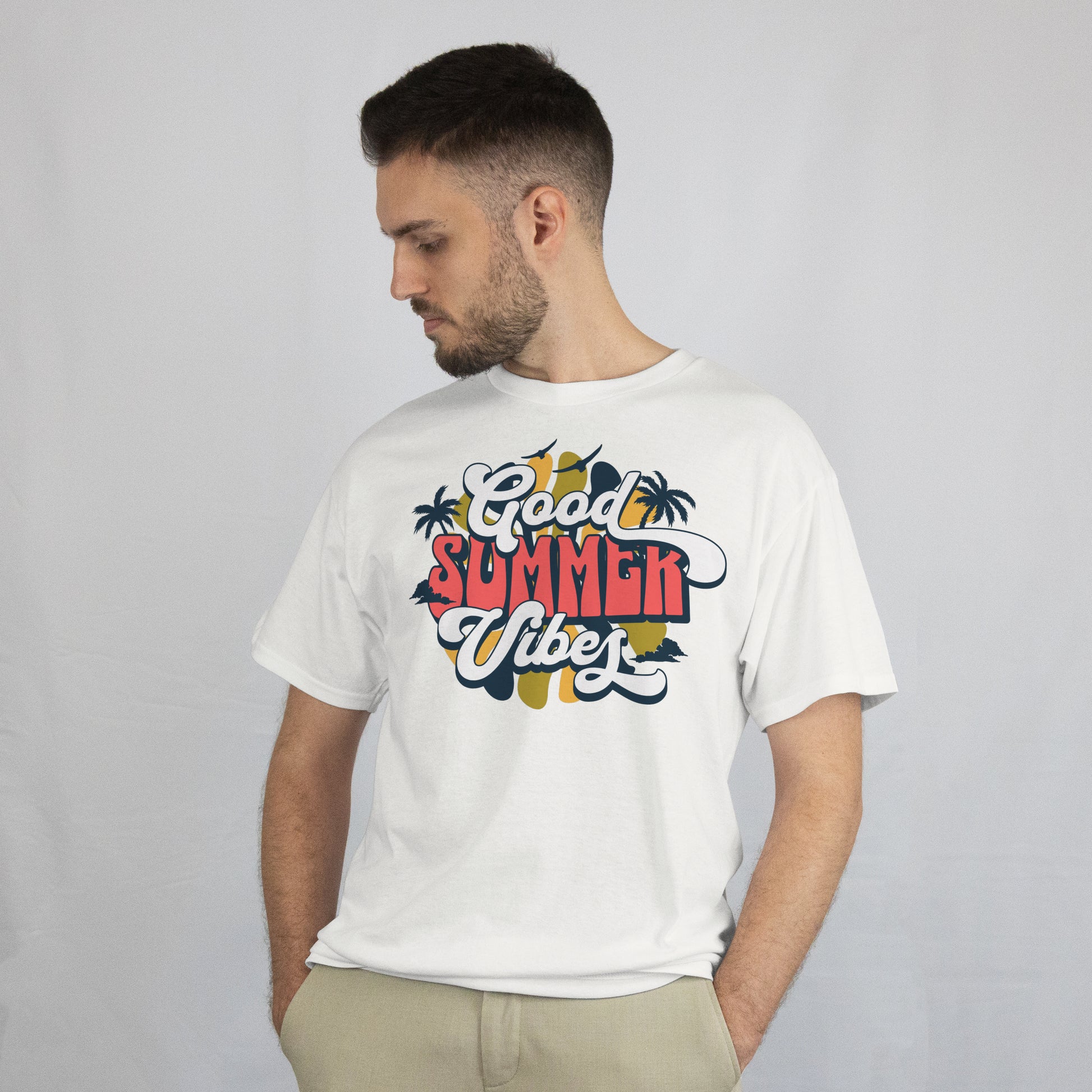 Man wearing a white t-shirt with 'Good Summer Vibes' text and palm tree graphics on a plain background