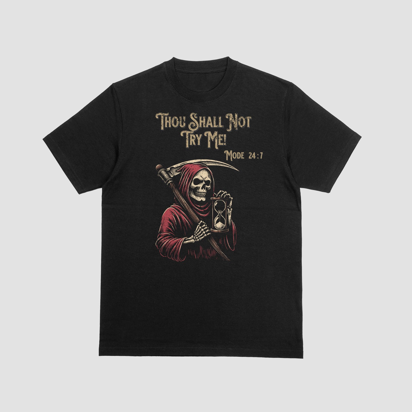 Black t-shirt with a Grim Reaper holding a hourglass with text 'Thou Shall Not Try Me! Mode 24:7' on a white background on a gray background