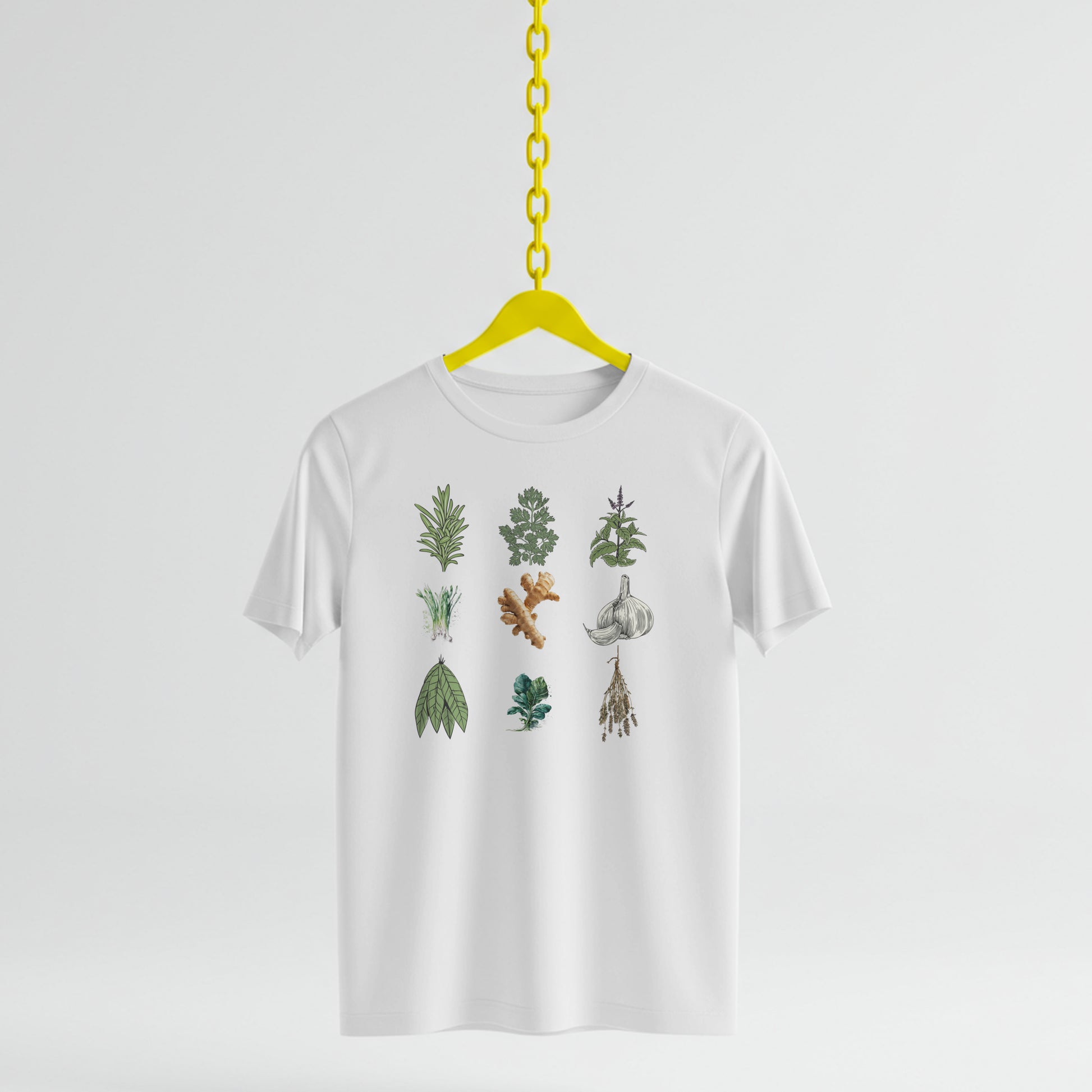 White t-shirt with Illustrations of various herbs and spices on a white background on a yellow hanger against a white background