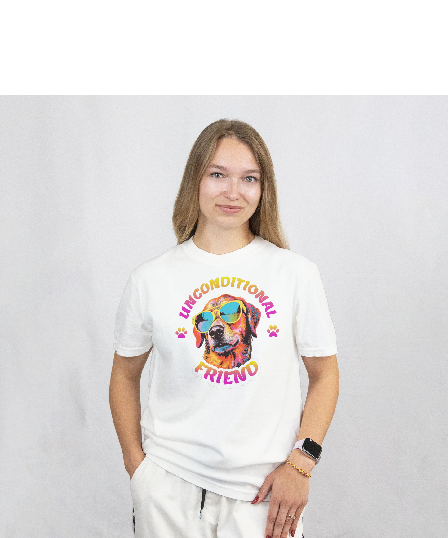 Person wearing a white t-shirt with a Colorful dog wearing sunglasses with 'Unconditional Friend' text on a white background