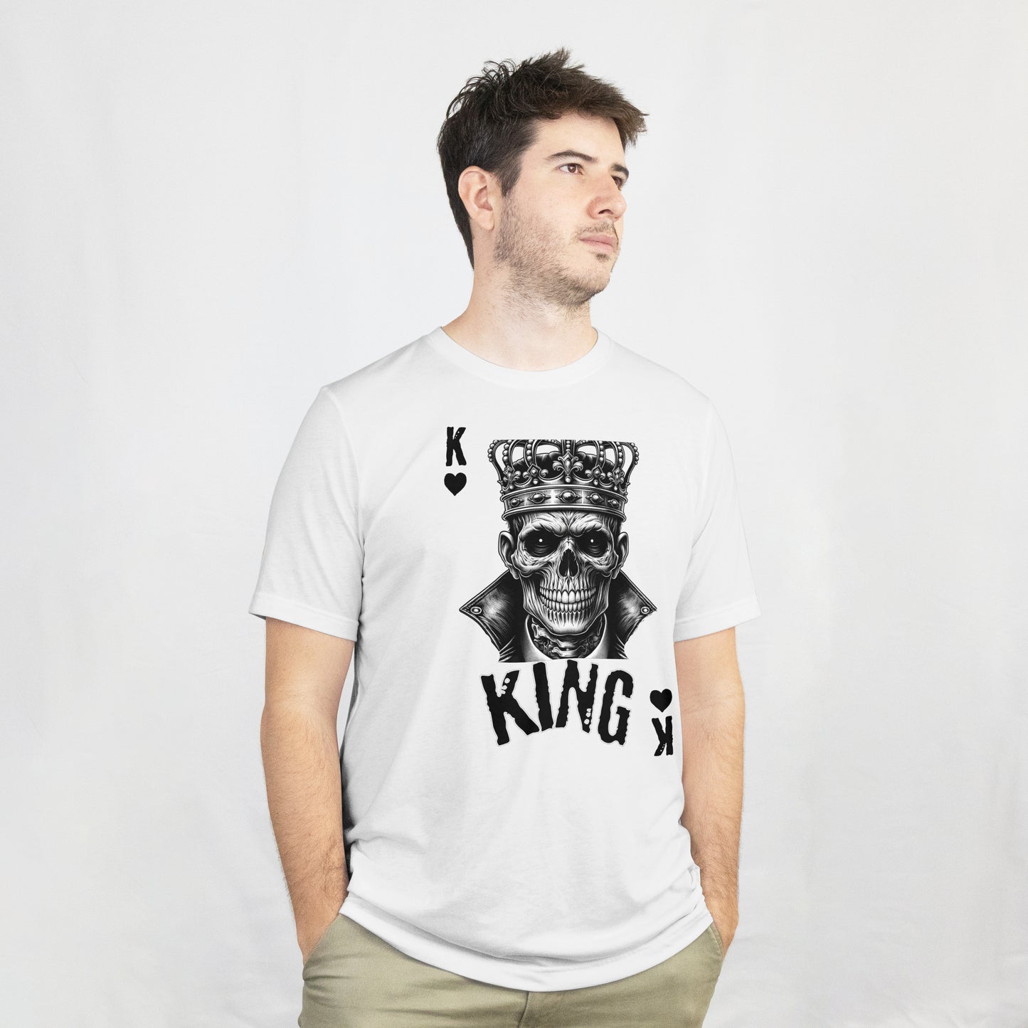 Man wearing a white t-shirt with a skull wearing a crown with 'KING' text and playing card symbols on a white background