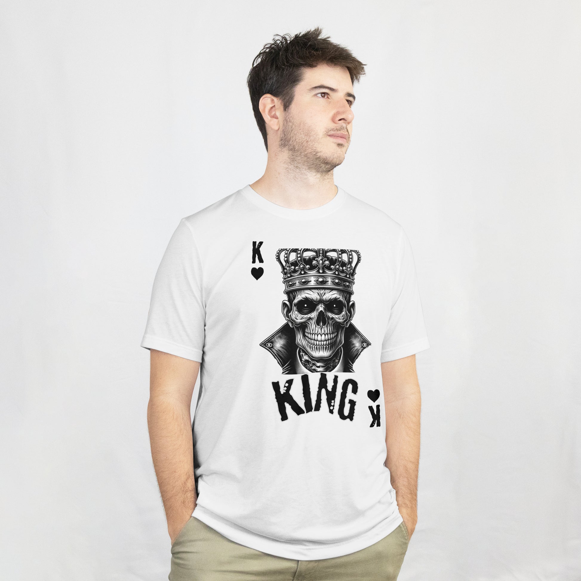 Man wearing a white t-shirt with a skull wearing a crown with 'KING' text and playing card symbols on a white background